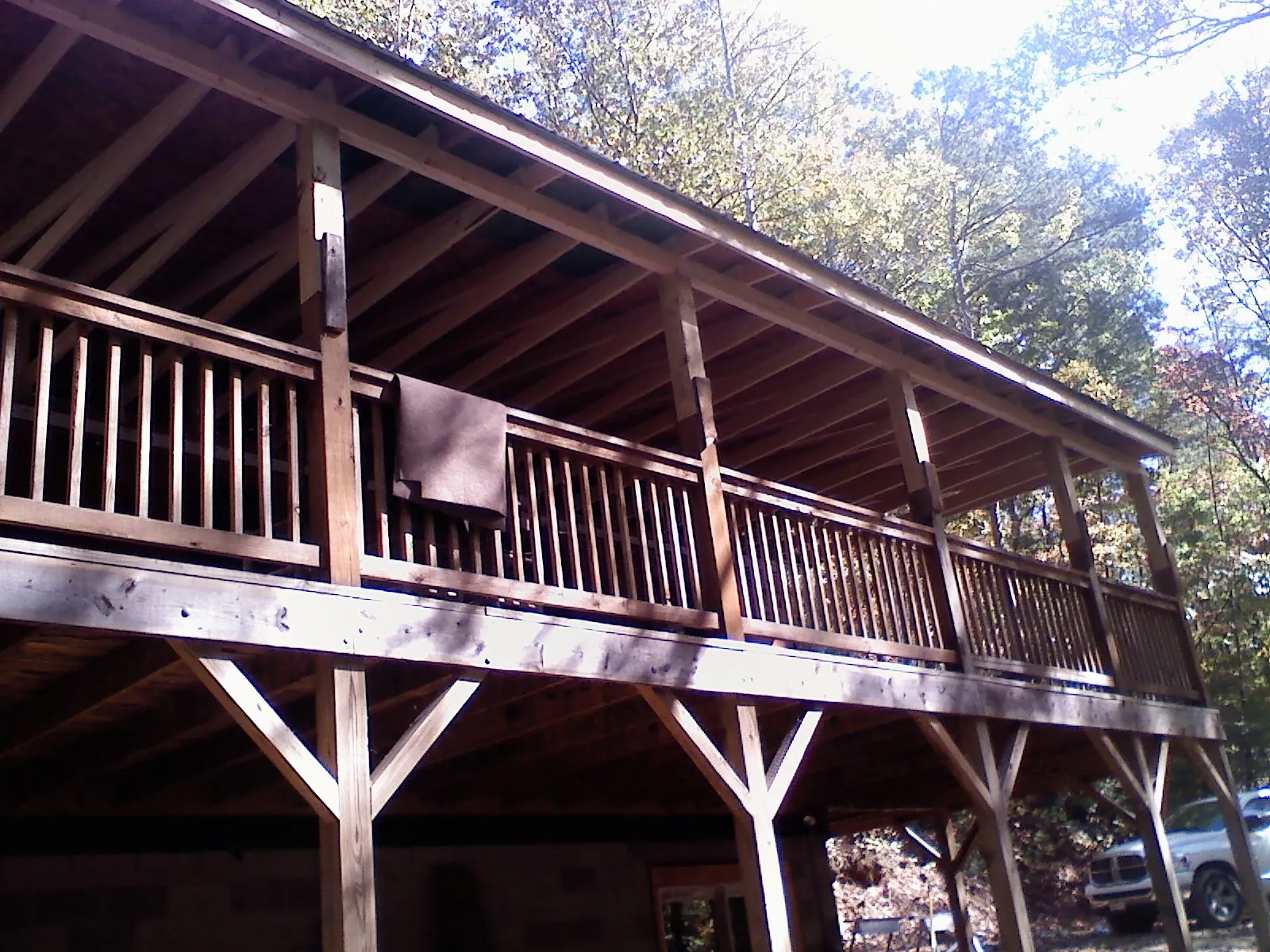 Timber framing under a new elevated porch and deck — Roof Leak Repair in Ovando by Roofing Brothers